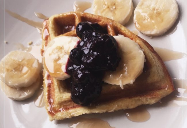 gluten-free waffle with blueberry syrup, bananas